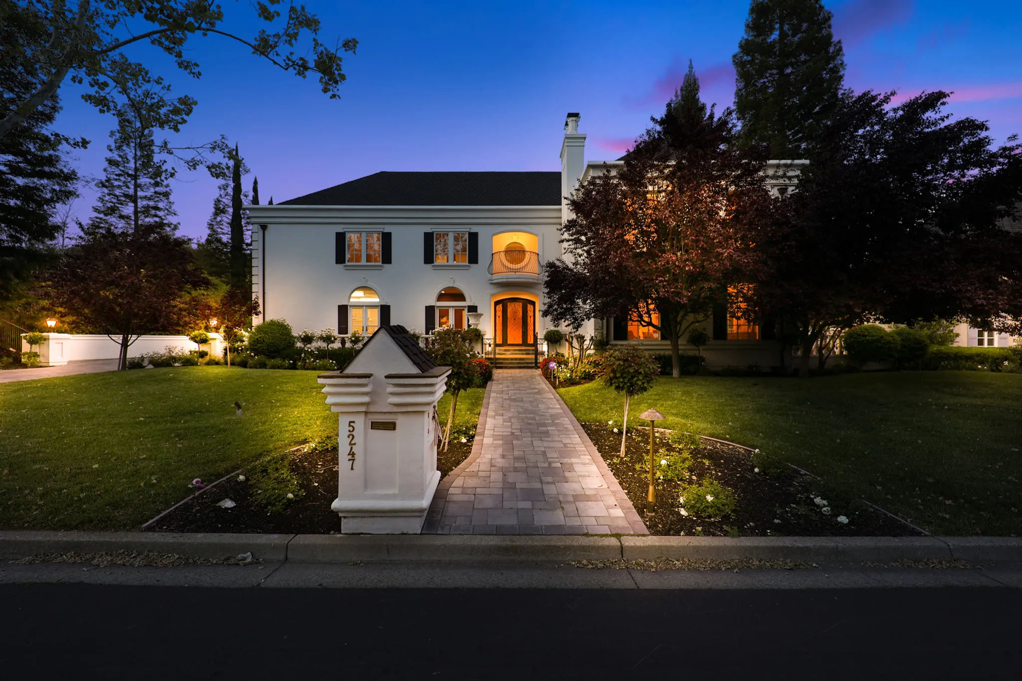Twilight Photos Home exterior photographed at twilight with warm interior lighting
